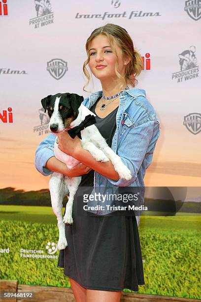 Emma Schweiger and moviedog Frodo attend the 'Conni&Co' Berlin Premiere on August 13, 2016 in Berlin, Germany.