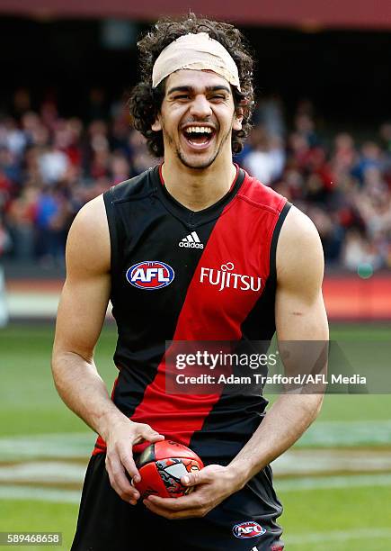 Debutante, Jake Long of the Bombers celebrates during the 2016 AFL Round 21 match between the Essendon Bombers and the Gold Coast Suns at Etihad...