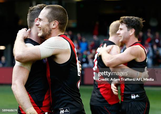 David Zaharakis of the Bombers celebrates with Craig Bird of the Bombers during the 2016 AFL Round 21 match between the Essendon Bombers and the Gold...