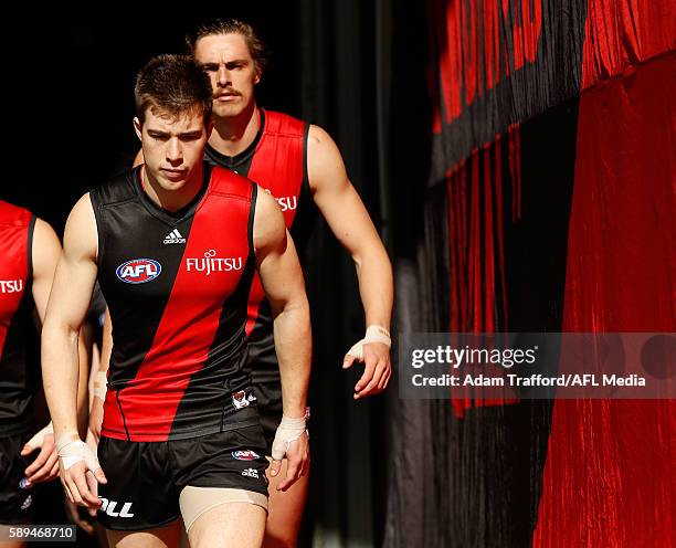 Acting captain Zach Merrett of the Bombers leads the team up the race during the 2016 AFL Round 21 match between the Essendon Bombers and the Gold...