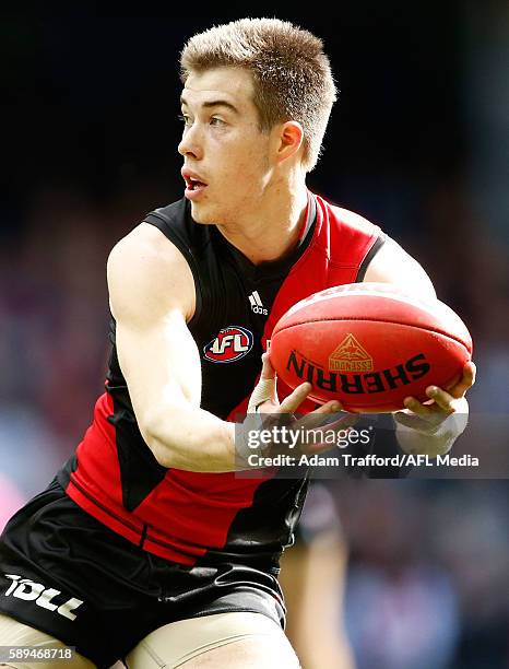 Acting captain Zach Merrett of the Bombers in action during the 2016 AFL Round 21 match between the Essendon Bombers and the Gold Coast Suns at...