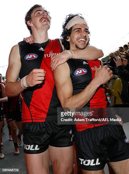 Joe Daniher and Debutante, Jake Long of the Bombers celebrate during the 2016 AFL Round 21 match between the Essendon Bombers and the Gold Coast Suns...