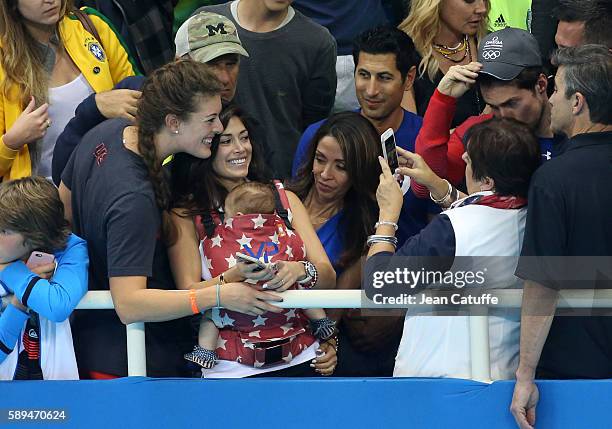 Allison Schmitt of Team USA, Nicole Johnson, fiancee of Michael Phelps - holding their baby son Boomer Phelps -, and Debbie Phelps, Michael's mother...