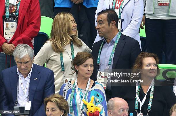 Of Nissan and CEO of Renault Carlos Ghosn and his wife Carole Ghosn attend the swimming finals on day 8 of the Rio 2016 Olympic Games at Olympic...