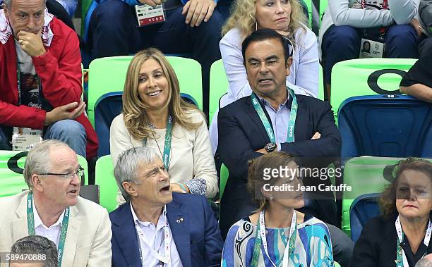Of Nissan and CEO of Renault Carlos Ghosn and his wife Carole Ghosn attend the swimming finals on day 8 of the Rio 2016 Olympic Games at Olympic...