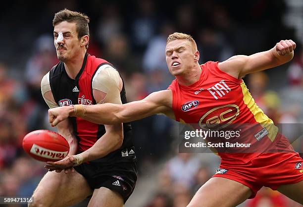 Michael Hartley of the Bombers competes for the ball during the round 21 AFL match between the Essendon Bombers and the Gold Coast Suns at Etihad...