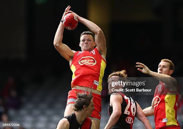 Steven May of the Suns marks the ball during the round 21 AFL match between the Essendon Bombers and the Gold Coast Suns at Etihad Stadium on August...