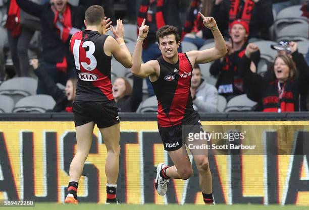 Jackson Merrett of the Bombers celebrates after kicking a goal during the round 21 AFL match between the Essendon Bombers and the Gold Coast Suns at...