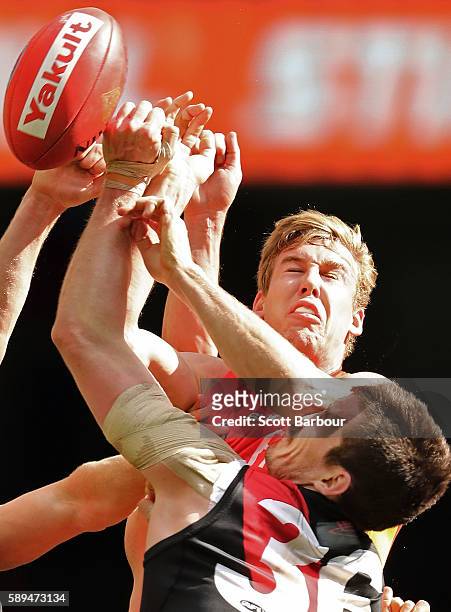 Michael Hartley has his nose broken as Tom Lynch of the Suns and Michael Hartley of the Bombers compete for the ball during the round 21 AFL match...