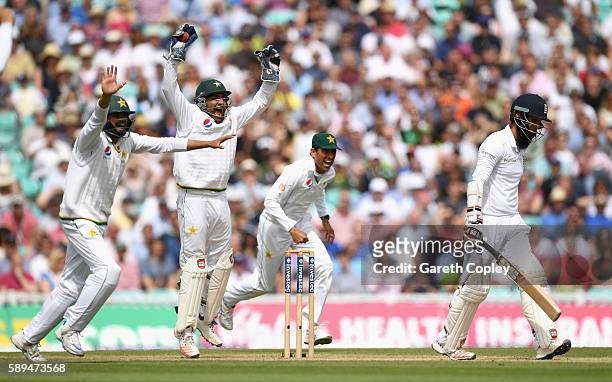 Azhar Ali, Sarfraz Ahmed and Younis Khan of Pakistan celebrate the wicket of Moeen Ali of England during day four of the 4th Investec Test between...