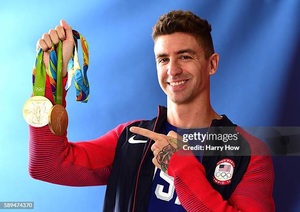 Swimmer, Anthony Ervin of the United States poses for a photo with his two gold medals on the Today show set on Copacabana Beach on August 13, 2016...