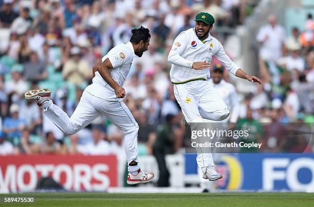 Azhar Ali of Pakistan celebrates with Wahab Riaz after catching out Jonathan Bairstow of England during day four of the 4th Investec Test between...