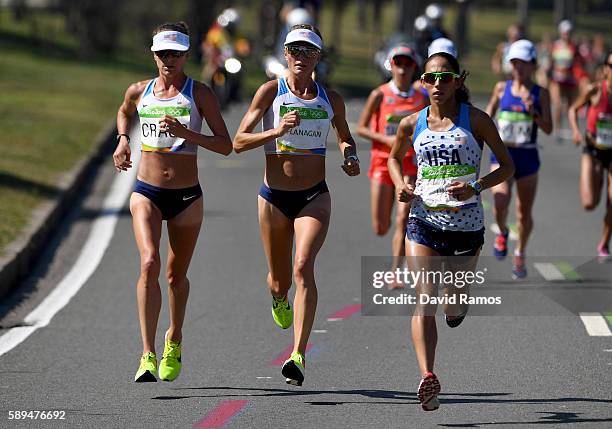 Amy Cragg of the United States, Shalane Flanagan of the United States and Desiree Linden of the United States compete during the Women's Marathon on...