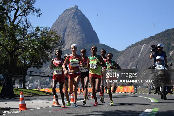 Bahrain's Rose Chelimo, Belarus' Volha Mazuronak, Ethiopia's Tirfi Tsegaye and Ethiopia's Mare Dibaba lead the race during the Women's Marathon...