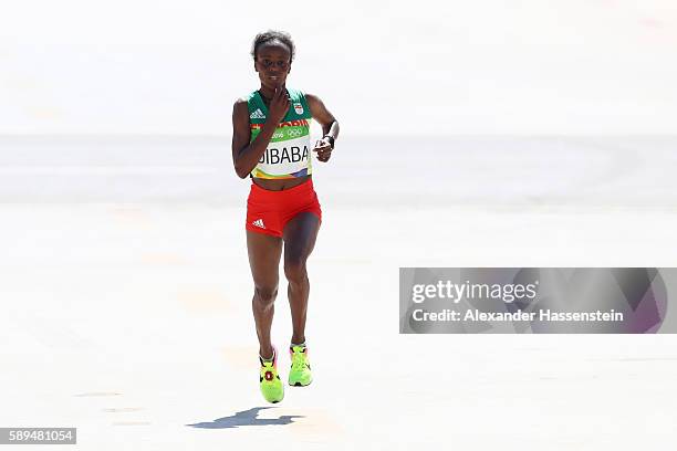 Mare Dibaba of Ethiopia approaches the finish line for a 3rd place finish during the Women's Marathon on Day 9 of the Rio 2016 Olympic Games at the...