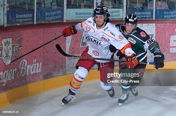 Daniel Weiss of the Duesseldorfer EG and Andreas Nowak of the Starbulls Rosenheim during the test match between the Starbulls Rosenheim and the...