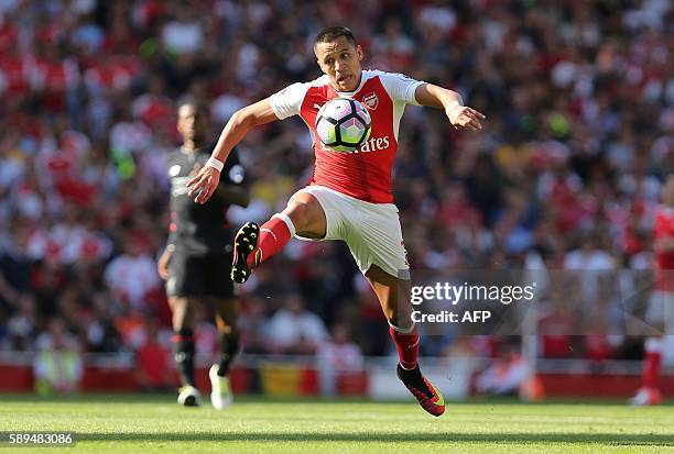 Arsenal's Chilean striker Alexis Sanchez controls the ball during the English Premier League football match between Arsenal and Liverpool at the...