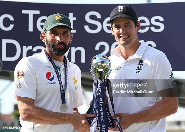 Misbah-ul-Haq of Pakistan and Alastair Cook of England pose with the trophy after the series was drawn day four of the 4th Investec Test match...