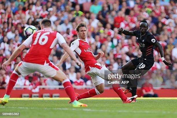 Liverpool's Senegalese midfielder Sadio Mane scores Liverpool's fourth goal during the English Premier League football match between Arsenal and...