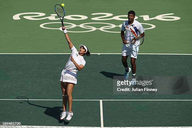 Rohan Bopanna and Sania Mirza of India in action during the mixed doubles bronze medal match against Radek Stepanek and Lucie Hradecka of the Czech...