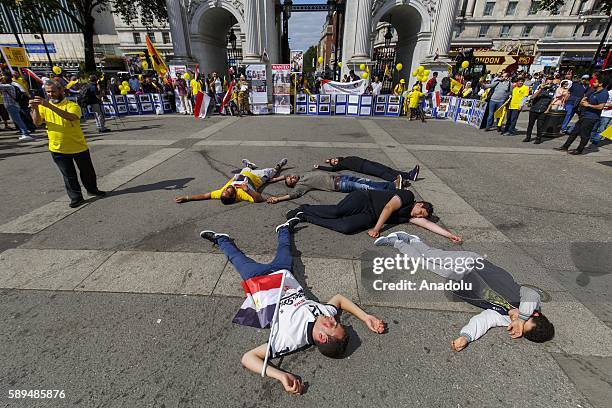 Pro-Morsi demonstrators protest on the 3rd anniversary of Egypt's 2013 Rabaa massacre at Marble Arch, London, England on August 14, 2016. In 2013...