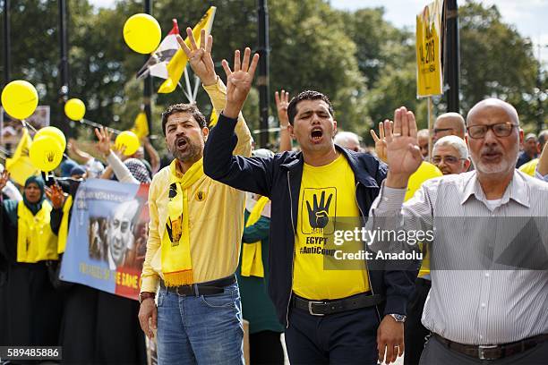 Pro-Morsi demonstrators protest on the 3rd anniversary of Egypt's 2013 Rabaa massacre at Marble Arch, London, England on August 14, 2016. In 2013...