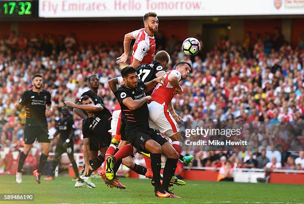 Calum Chambers of Arsenal scores his team's third goal during the Premier League match between Arsenal and Liverpool at Emirates Stadium on August...