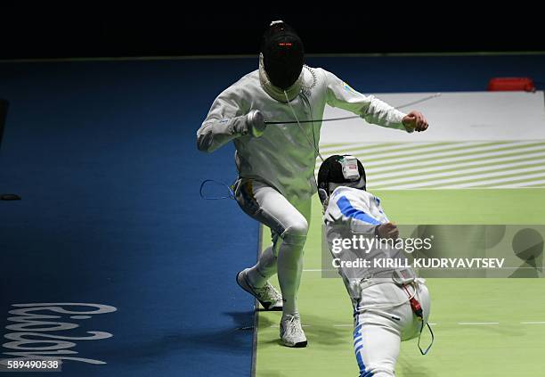 Ukraine's Bogdan Nikishin competes against Italy's Paolo Pizzo during the mens team epee semi-final bout between Italy and Ukraine as part of the...