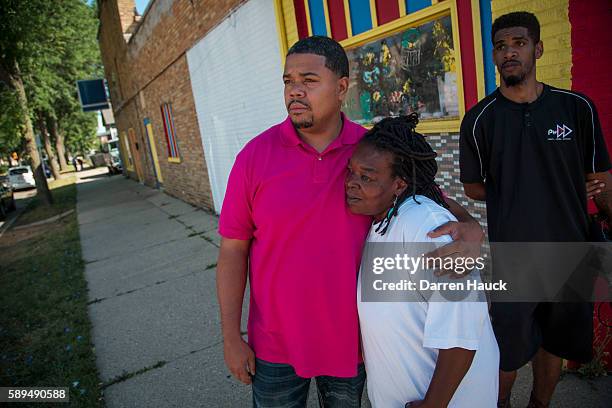 7th district Alderman Khalif Rainey, left, hugs a community member after rioters clashed with the Milwaukee Police Department protesting an officer...