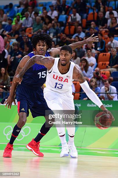 Carmelo Anthony of United States moves the ball against Mickael Gelabale of France during a Men's Preliminary Round Group A game between the United...