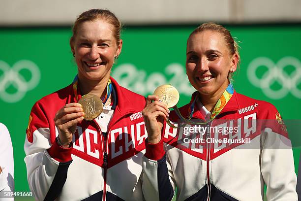 Gold medalists Elena Vesnina and Ekaterina Makarova of Russia pose on the podium during the ceremony for the women's doubles on Day 9 of the Rio 2016...