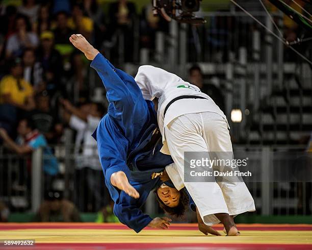 Idalys Ortiz of Cuba side steps an attack by Kanae Yamabe of Japan to score the winning yuko to reach the o78kg final during day 7 of the 2016 Rio...
