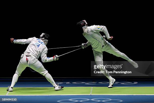 Paolo Pizzo of Italy competes against Bogdan Nikishin of Ukraine during the Men's during the Men's Epee Team Semifinal on Day 9 of the Rio 2016...