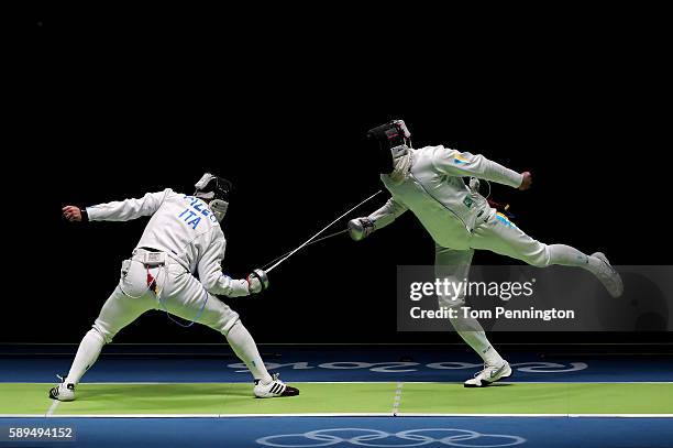Paolo Pizzo of Italy competes against Bogdan Nikishin of Ukraine during the Men's during the Men's Epee Team Semifinal on Day 9 of the Rio 2016...
