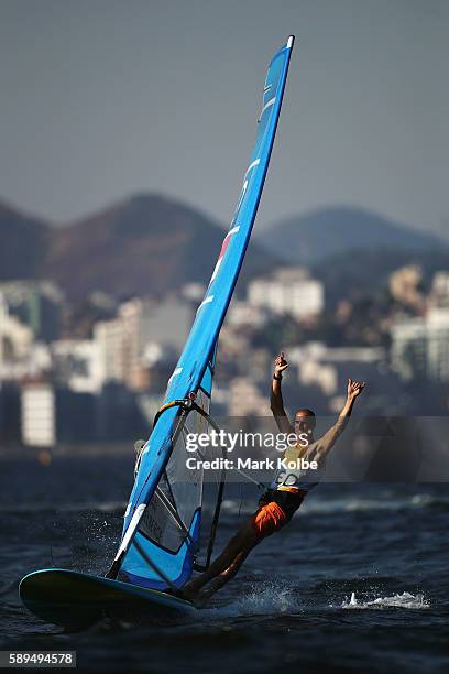 Dorian van Rijsselberghe of the Netherlands celebrates winning the overall Men's RS:X class on Day 9 of the Rio 2016 Olympic Games at the Marina da...