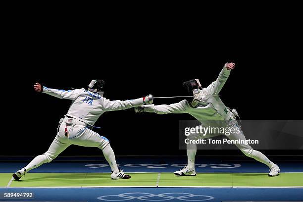 Paolo Pizzo of Italy competes against Bogdan Nikishin of Ukraine during the Men's during the Men's Epee Team Semifinal on Day 9 of the Rio 2016...