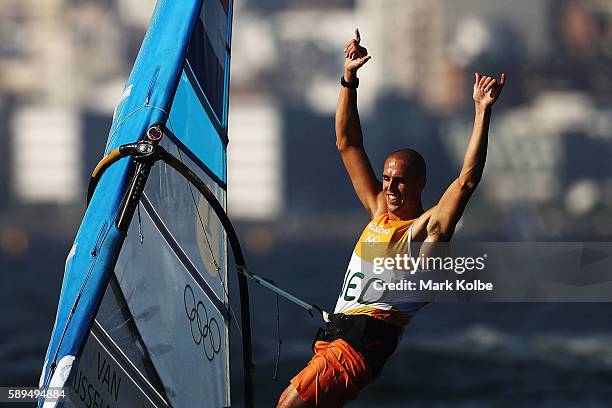 Dorian van Rijsselberghe of the Netherlands celebrates winning the overall Men's RS:X class on Day 9 of the Rio 2016 Olympic Games at the Marina da...