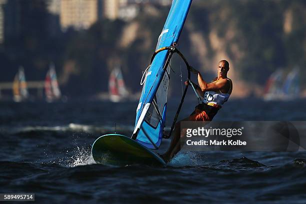 Dorian van Rijsselberghe of the Netherlands competes on his way to winning the overall Men's RS:X class on Day 9 of the Rio 2016 Olympic Games at the...