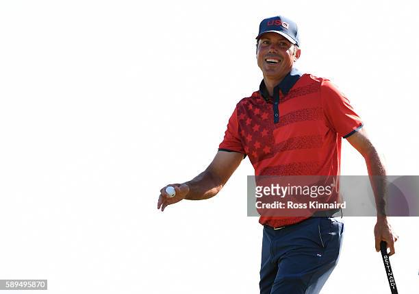 Matt Kuchar of the United States reacts after putting for par on the 18th green during the final round of men's golf on Day 9 of the Rio 2016 Olympic...