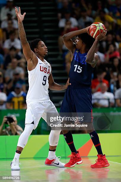 Demar DeRozan of United States defends against Mickael Gelabale of France during a Men's Preliminary Round Group A game between the United States and...
