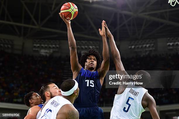 Mickael Gelabale of France shoots against Kevin Durant of United States during a Men's Preliminary Round Group A game between the United States and...