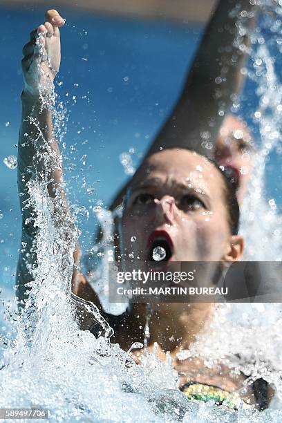 Kazakhstan's Alexandra Nemich and Yekaterina Nemich compete in the Duets Free Routine preliminaries during the synchronised swimming event at the...