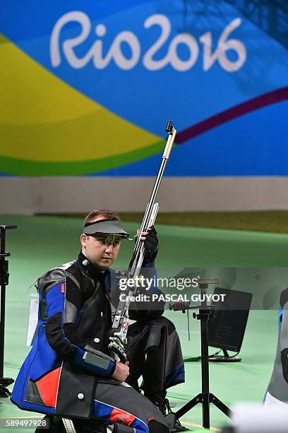 Bronze medallist France's Alexis Raynaud holds his gun during the 50m Rifle 3 positions men's finals at the Olympic Shooting Centre in Rio de Janeiro...