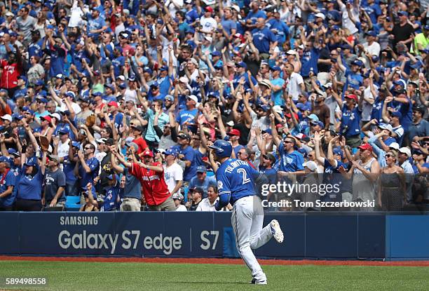 Troy Tulowitzki of the Toronto Blue Jays circles the bases as he hits a three-run home run in the fifth inning during MLB game action against the...