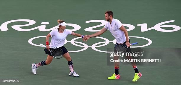 S Jack Sock and USA's Bethanie Mattek-Sands react as they play against USA's Venus Williams and USA's Rajeev Ram during their mixed doubles gold...