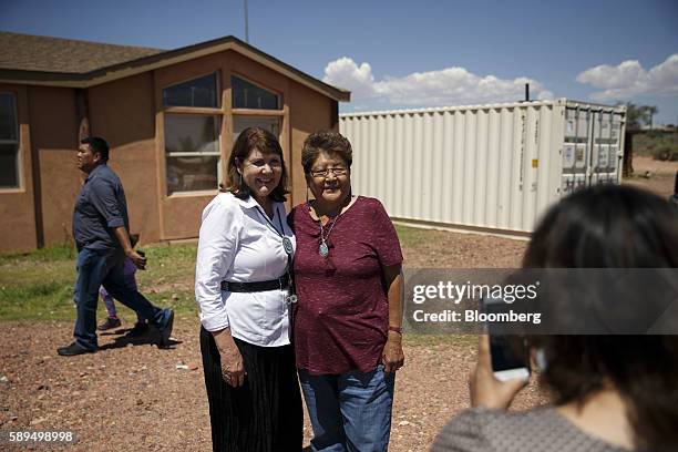 Representative Ann Kirkpatrick, a Democrat from Arizona, left, stands for a photograph with an attendee during a campaign event on the Navajo Nation...