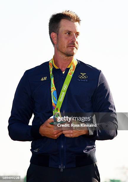 Henrik Stenson of Sweden celebrates with the silver medal after the final round of men's golf on Day 9 of the Rio 2016 Olympic Games at the Olympic...