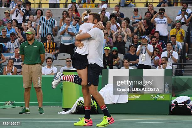 S Jack Sock and USA's Bethanie Mattek-Sands celebrate after beating USA's Venus Williams and USA's Rajeev Ram in their mixed doubles gold medal...