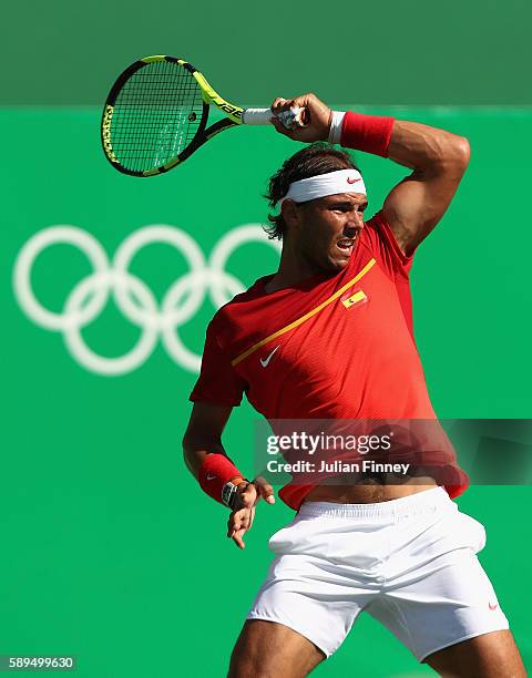 Rafael Nadal of Spain makes a return during the singles bronze medal match against Kei Nishikori of Japan on Day 9 of the Rio 2016 Olympic Games at...