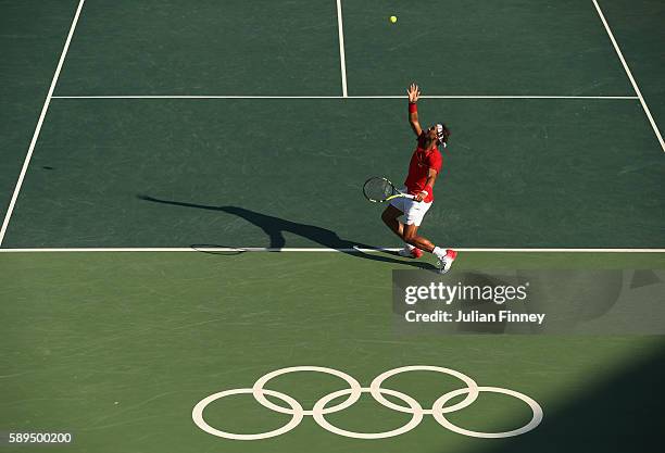 Rafael Nadal of Spain serves during the singles bronze medal match against Kei Nishikori of Japan on Day 9 of the Rio 2016 Olympic Games at the...